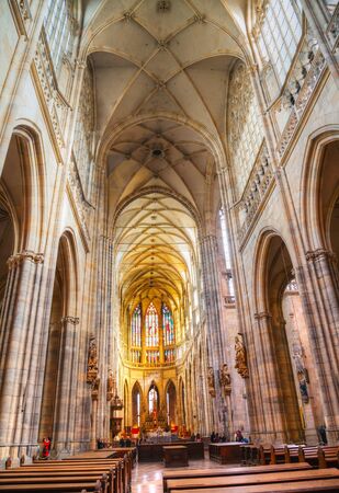 PRAGUE - OCTOBER 09: Saint Vitus Cathedral interior with tourists on October 09, 2012 in Prague. It's located within Prague Castle and containing the tombs of many Bohemian kings and Holy Roman Emperors.のeditorial素材