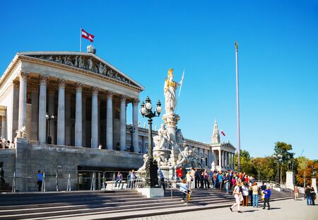 VIENNA - OCTOBER 06: Austrian parliament building (Hohes Haus) with tourists on October 06, 2012 in Vienna, Austria. The building covers over 13,500 square meters, making it one of the largest structures on the Ringstrase.のeditorial素材