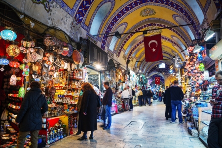 ISTANBUL - APRIL 8: Grand Bazaar interior on April 8, 2013 in Istanbul. It's one of the largest and oldest covered markets in the world, with 61 covered streets and over 3,000 shops which attract between 250,000 and 400,000 visitors daily.のeditorial素材