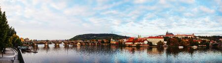 Panoramic overview of old Prague with Charles bridge in the eveningのeditorial素材