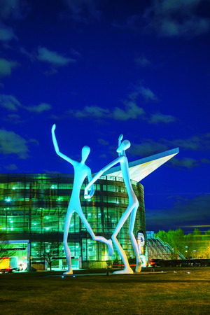 DENVER - May 1, 2014: The Dancers public sculpture at night time on May 1, 2014 in Denver, Colorado. The Dancers was permanently installed in front of the Denver Performing Arts Complex on June 12, 2003.のeditorial素材
