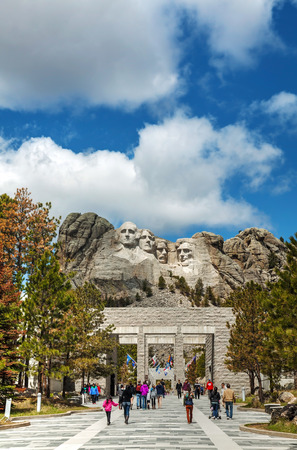 KEYSTONE, SD - MAY 10: Mount Rushmore monument with tourists on May 10, 2014 near Keystone, SD. It's a sculpture carved into the granite features 60-foot sculptures of the heads of 4 US presidents.のeditorial素材
