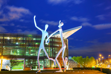 DENVER - May 1, 2014: The Dancers public sculpture at night time on May 1, 2014 in Denver, Colorado. The Dancers was permanently installed in front of the Denver Performing Arts Complex on June 12, 2003.のeditorial素材