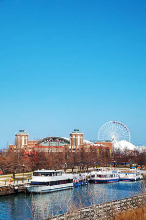 CHICAGO - APRIL 9: Navy Pier on April 9, 2014 in Chicago, IL. It's is a 3,300-foot (1,010 m) long pier on the Chicago shoreline of Lake Michigan. Navy Pier is Chicago's number one tourist attraction.のeditorial素材