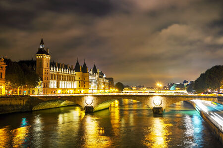 The Conciergerie building in Paris, France in the nightの写真素材