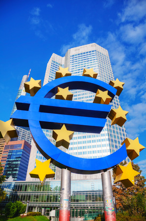 FRANKFURT - OCTOBER 14: Euro sign in front of the European Central Bank building on October 14, 2014 in Frankfurt, Germany. It's the central bank for the euro and administers monetary policy of the Eurozone.のeditorial素材