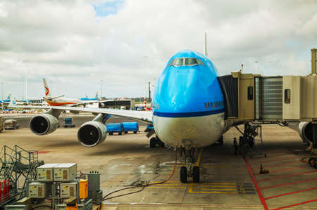 AMSTERDAM - APRIL 8: A plane at the Schiphol internationsl airport gate on April 8, 2014 in...