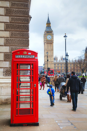 LONDON - APRIL 4: Famous red telephone booth on April 4, 2015 in London, UK. The red telephone box, a telephone kiosk for a public telephone designed by Sir Giles Gilbert Scott.のeditorial素材