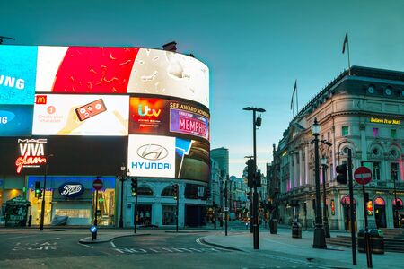 LONDON - APRIL 12: Piccadilly Circus junction early in the morning on April 12, 2015 in London, UK....