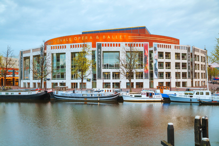 AMSTERDAM - APRIL 16: Nationale opera and ballet building (Stopera) on April 16, 2015 in Amsterdam, Netherlands. The Stopera is located in the center of Amsterdam.のeditorial素材