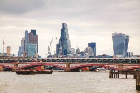Financial district of London city on an overcast dayの写真素材