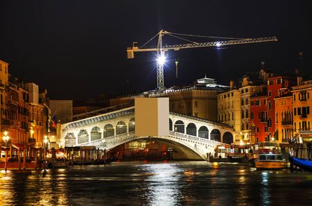 Rialto bridge (Ponte di Rialto) in Venice, Italy at nightの写真素材