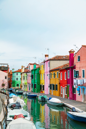 BURANO, ITALY - NOVEMBER 23: Brightly painted houses at the Burano canal on November 23, 2015 in Burano, Venice, Italy. It's an island in the Venetian Lagoon, northern Italy.のeditorial素材