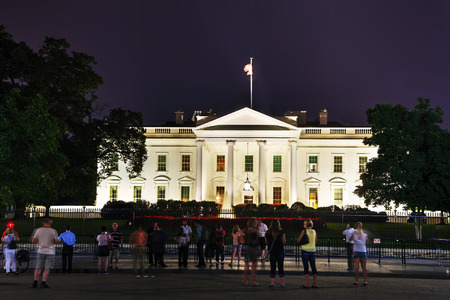 WASHINGTON, DC - SEPTEMBER 2: The White House building with tourists on September 2, 2015 in Washington, DC. The White House is the official residence and principal workplace of the President of the United Statesのeditorial素材