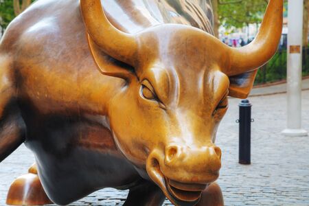 NEW YORK CITY - September 3: Charging Bull sculpture on September 3, 2015 in New York City. The sculpture is both a popular tourist destination, as well as "one of the most iconic images of New York".のeditorial素材