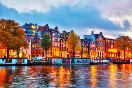Amsterdam city view with Amstel river at sunsetの写真素材