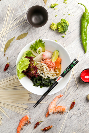 Japanese, egg noodles with seafood on a white plateのeditorial素材