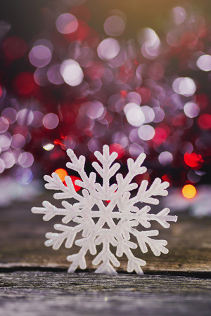 snowflakes on a wooden background.の写真素材