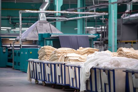 Textile Manufacturing. Knitted fabric. Textile factory in spinning production line and a rotating machinery and equipment production company.の写真素材