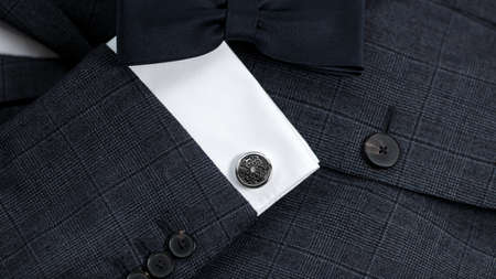 Luxury bow tie close up with vintage suit and cufflink.