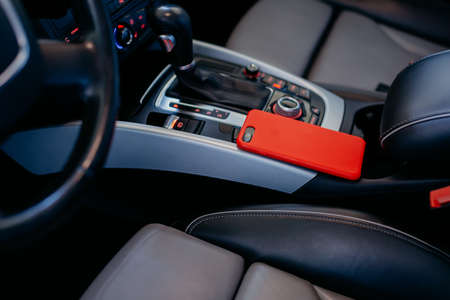 Smartphone on the modern car interior.の写真素材