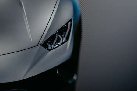 Modern luxury car close-up banner background. Concept of expensive, sports auto.の写真素材