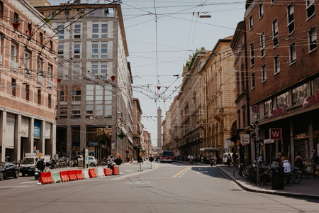 Bologna, Italy - 04, 03, 2021: Old narrow street with arcade in Bologna, Emilia Romagna, Italy. Architecture and landmark of Bologna. Cityscape of Bologna.のeditorial素材