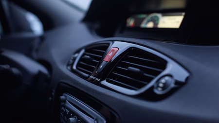 Ventilation vents with air flow deflectors and car emergency lights button.の写真素材
