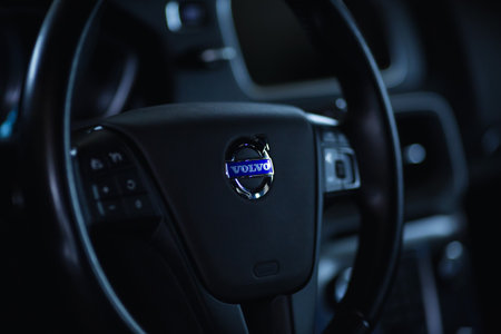 Close up Volvo logo on the steering wheel. Volvo V40 dashboard interior.