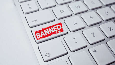 Banned red sign on the keyboard. Banned concept.の写真素材