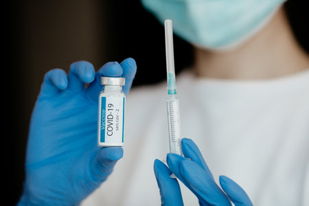 Development and creation of a coronavirus vaccine COVID-19. Coronavirus Vaccine concept in hand of doctor vaccine.の写真素材