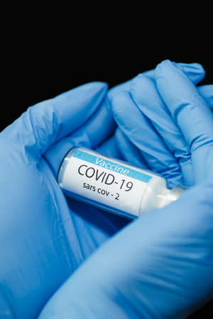 Doctor holding vaccine close up.の写真素材