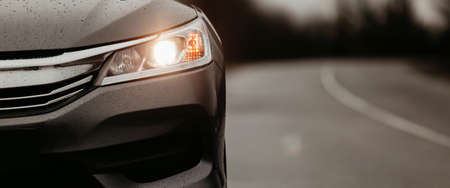 Front grill, headlights. Luxury stylish sport car banner with road.の写真素材