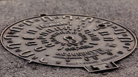 Old manhole tsover on the stone pavement.のeditorial素材