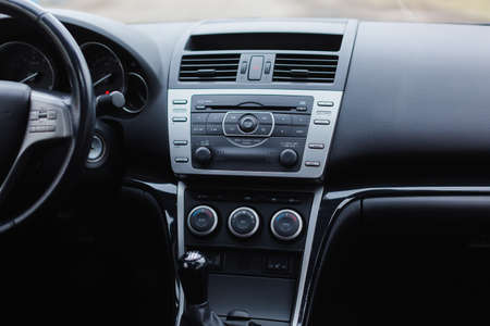 Car climate control panel for driver and passenger with shallow depth of field close up. modern car interior.の写真素材