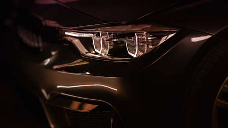 Concept of expensive, sports auto. Headlight lamp of new cars.の写真素材