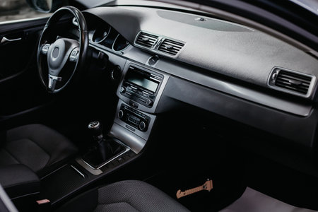 Modern car interior: steering wheel, gearshift lever, multimedia system and dashboard.の写真素材