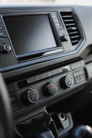 Modern car interior, detail of the dashboard and air conditioning control panel