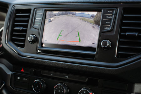 Interior view of a modern car with dashboard, steering wheel and dashboard