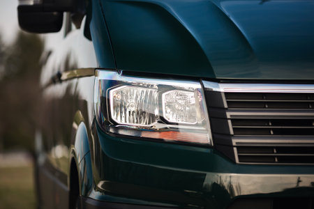 Closeup of a headlight of a modern car on a sunny day
