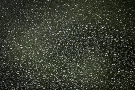 Natural water drops on glassの写真素材