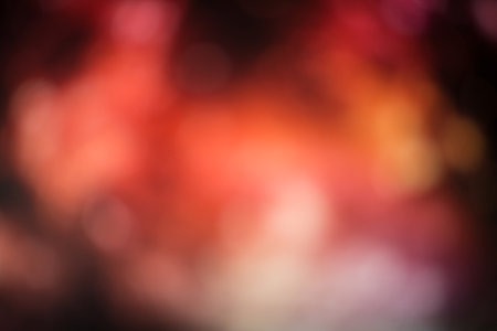 Artistic bokeh background. Soft red defocused lightsの写真素材