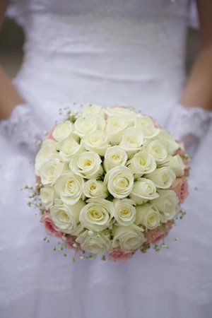 Beautiful wedding bouquet in hands of the brideの写真素材