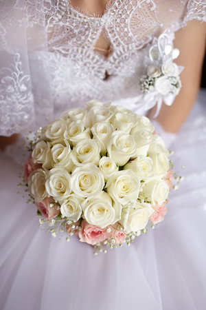 Bride holding bouquet of flowersの写真素材