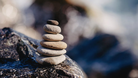 Pile of zen stones on the beach. Zen concept.の写真素材