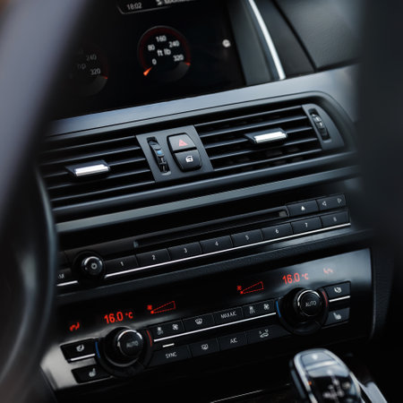 Interior of modern car. Steering wheel and air conditioning systemの写真素材