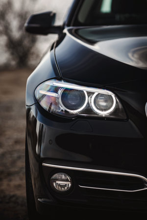 Modern car headlights close up. Prestigious auto wallpaper.の写真素材