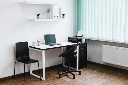 Interior of a modern office with desk and chair, nobody insideの写真素材