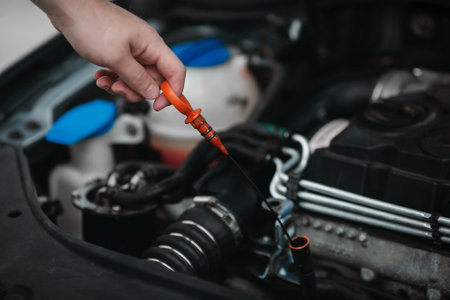 Auto mechanic repairing car engine in auto repair shop. Car service.