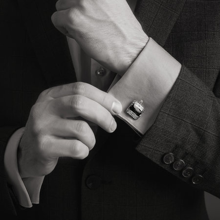 Wedding ring on the wrist of a man in a suitの写真素材